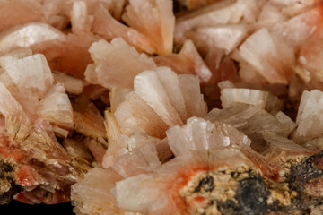 Macro of a stone Stilbite mineral on a black background