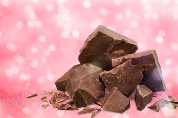 Dark chocolate blocks and bieces isolated on white background