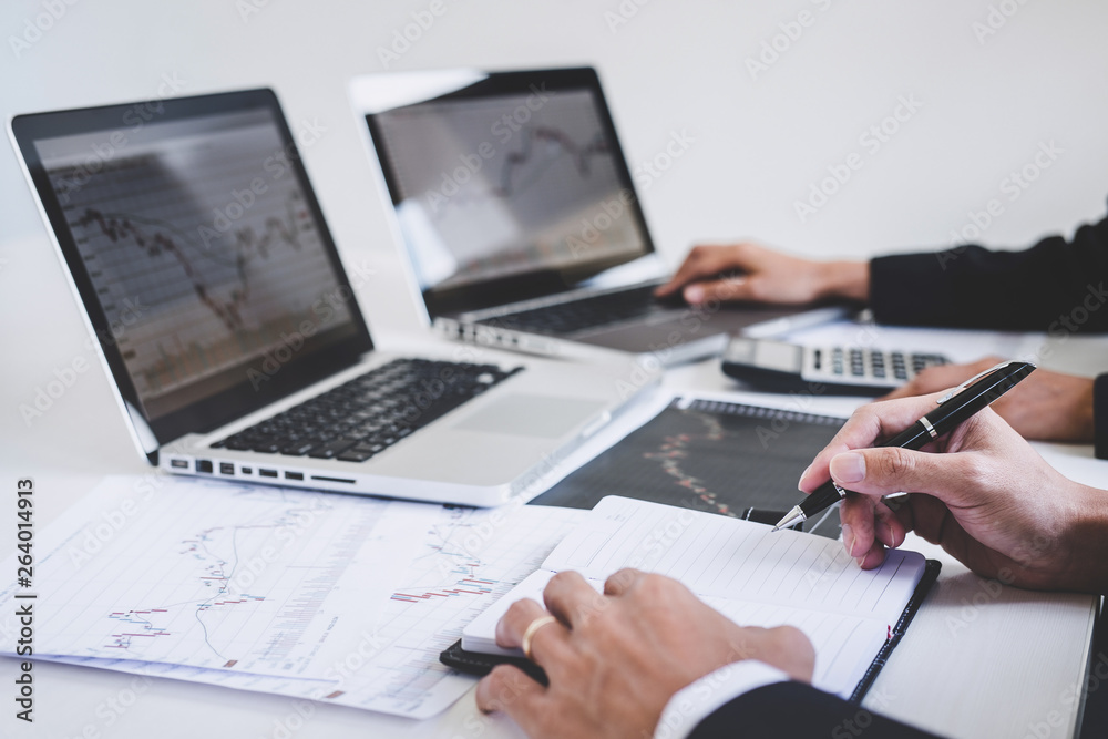 Poster Business team investment working with computer and analysis graph stock market trading with stock chart data, business and technology concept