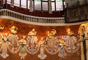 The interior of the concert hall of the Palace of Catalan music with sculptures depicting Greek...