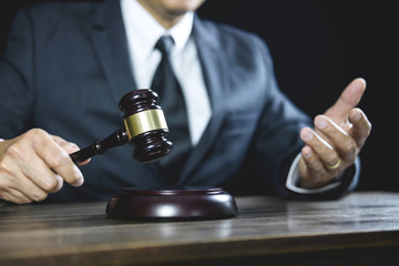 Legal law, Judge gavel with Justice lawyers advice with gavel and Scales of justice, Counselor or Male lawyer working on courtroom sitting at the table and papers