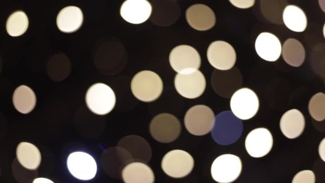 Beautiful bokeh in the night. White bokeh of faity lights
