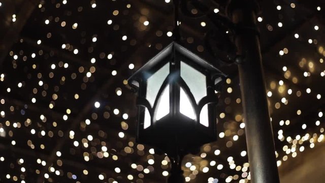 Beautiful bokeh in the night. White bokeh of faity lights