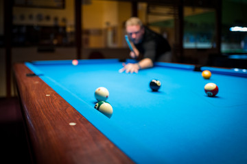 A man plasy Pool Billiard