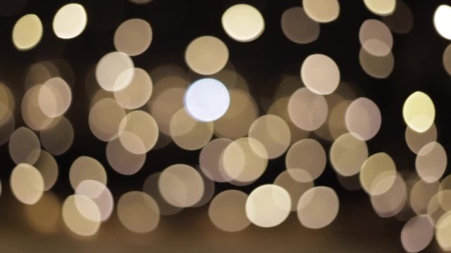 Beautiful bokeh in the night. White bokeh of faity lights