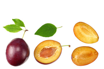 fresh plum fruit with green leaf and cut plum slices isolated on white background. top view