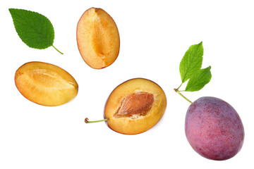 fresh plum fruit with green leaf and cut plum slices isolated on white background. top view