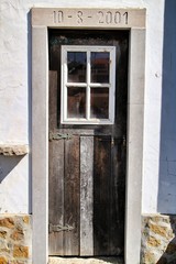 Old and colorful wooden door with iron details