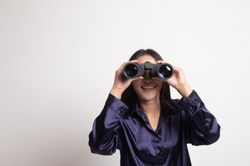 Young Asian woman with binoculars.
