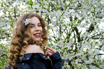 Beautiful happy girl in the spring in the fresh air