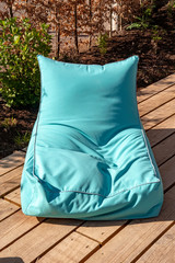 petrol colored beanbag comfortable and crumpled