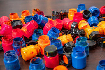 a lot of different paint cans opened on a mountain