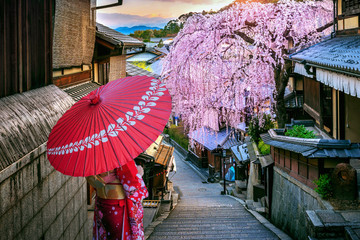Woman wearing japanese traditional kimono walking at Historic Higashiyama district in spring, Kyoto...