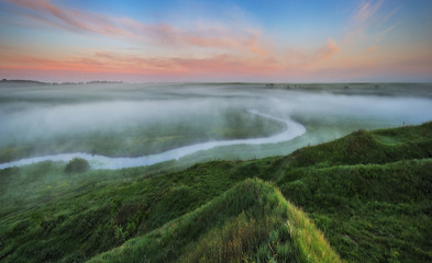 spring morning. sunrise in the valley of the picturesque river. foggy morning