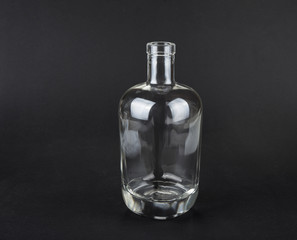 Empty spirit bottle on a black background