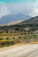 Fototapeta na wymiar Mountain road on Naxos Island in summer day. Cyclades, Greece