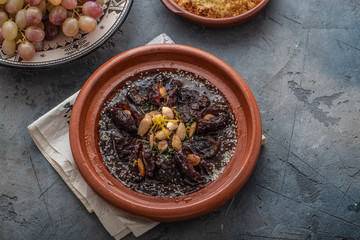 Slow cooked beef tajine with dates, raisins and almonds - moroccan cuisine, copy space