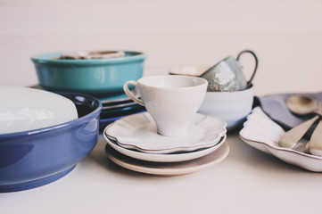ceramic tableware and cutlery in soft pastel neutral tones. Modern tableware for home