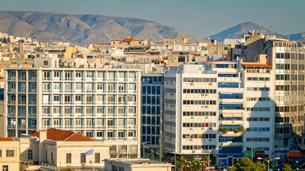 Schilderijen op glas Apartment buildings in downtown Athens, Greece - city skyline © CrackerClips