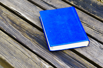 blue book on a bench 