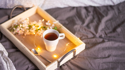 morning breakfast tray, a cup of coffee or tea in bed, hotel service. copy space