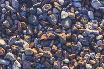 colorful stone ground bottom textures background pattern with blue toning, foreshortening from above
