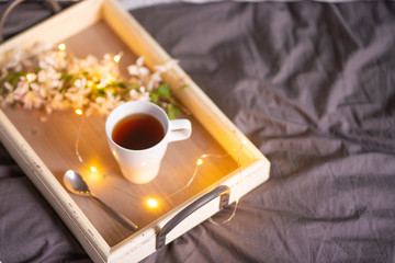 morning breakfast tray, a cup of coffee or tea in bed, hotel service. copy space