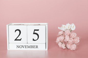November 25th. Day 25 of month. Calendar cube on modern pink background, concept of bussines and an importent event.