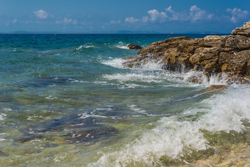 Waves breaking on a stony beach in Murter, Croatia, Dalmatia