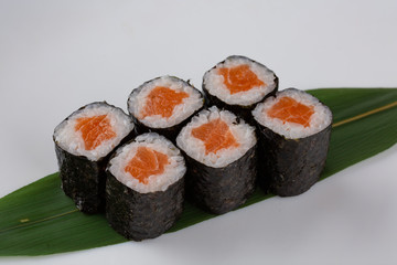Sake maki Japanese sushi rolls with salmon on white background