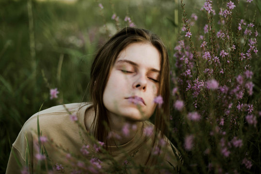 Portrait of a girl with spring wild flowers