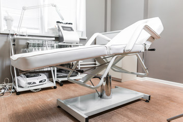 Chair for cosmetic procedures standing in the massage parlor