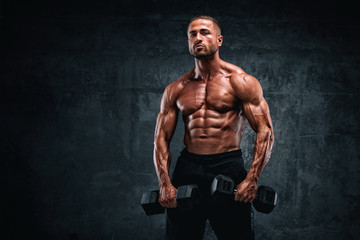Fototapeta na wymiar Strong Muscular Men Flexing Muscles