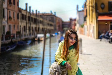 young woman on Venice canal background 