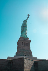 Fototapeta premium Statue of LIberty with a plane 
