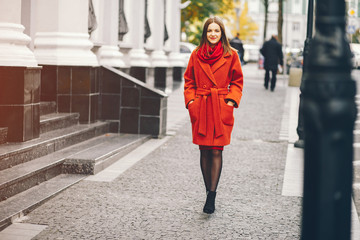 Fototapeta premium beautiful and stylish girl walking around the summer city