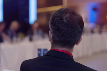Young businessman at business conference room with public giving presentations. Audience at the conference hall. Entrepreneurship club.