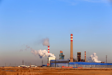 A chemical plant against a blue sky