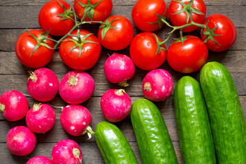 Harvested washed vegetables laid on wooden table. Agriculture background.