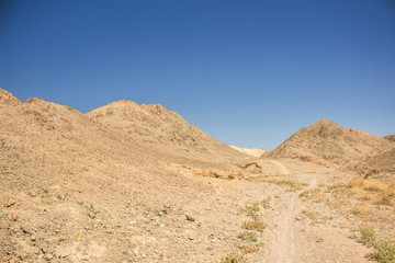 dunes sand stone mountains desert Atacama scenery landscape lonely ground trail path way to somewhere wilderness environment 