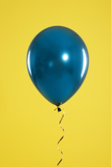 Bright balloon on color background. Celebration time