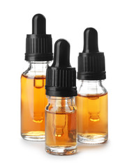 Bottles of essential oil isolated on white