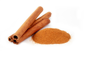 Top view cinnamon sticks and powder, isolated on white background.
