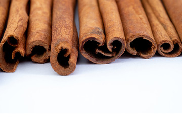 Top view cinnamon sticks isolated on white background.