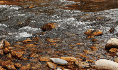 Beautiful view of a mountain river flowing between rocks in Turkey.