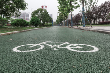 Green bicycle lane for biking, Beside the walkway