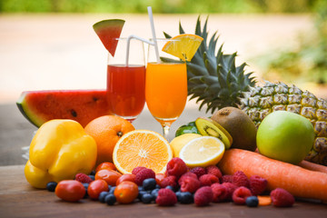 Set of tropical fruits colorful and fresh summer juice glass healthy foods / Many ripe fruit mixed on nature background