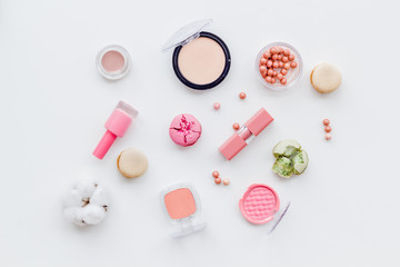 make-up accessories and fashion stylish cosmetics on white desk background top view pattern
