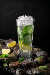 Lemonade from lime. Summer soft drink based on citruses, berries, sugar syrup, mint and ice. Cocktail card for a bar or restaurant.