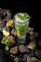 Lemonade from lime. Summer soft drink based on citruses, berries, sugar syrup, mint and ice. Cocktail card for a bar or restaurant.